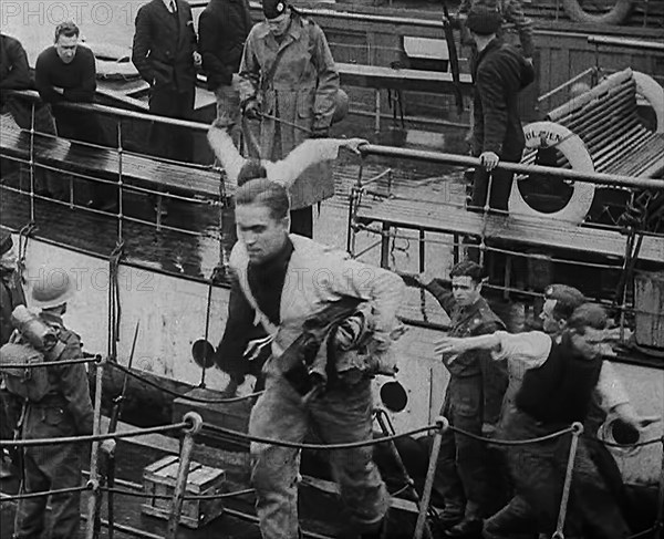 Crew of the Destroyed Bismarck Walking up a Gangplank Into a British Ship, 1943. Creator: British Pathe Ltd.