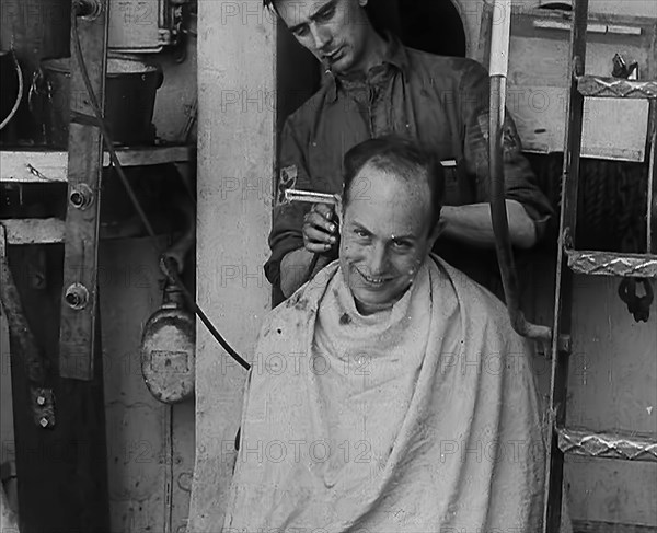 A Sailor Getting his Hair Cut, 1943. Creator: British Pathe Ltd.