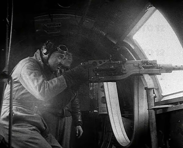 Actor Clark Gable Firing a Machine Gun Out of a Warplane, 1943-1944. Creator: British Pathe Ltd.