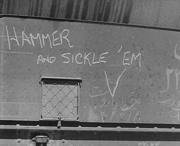 The Words: 'Hammer and Sickle ‘Em’ Written on Some Cargo, 1943. Creator: British Pathe Ltd.