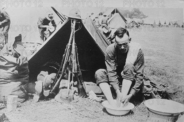 Washing tired feet, 1918. Creator: Bain News Service.