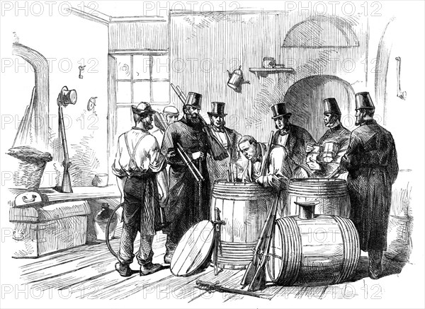 Sketches from Ireland: opening casks of arms at the Dublin Steam-Ship Company's stores..., 1870. Creator: Unknown.