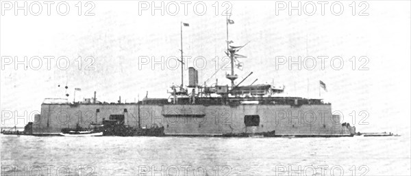 A battle-ship docked on the water: H.M.S. "Sans Pareil" on a floating-dock in the Tyne, 1909. Creator: L.N.A..