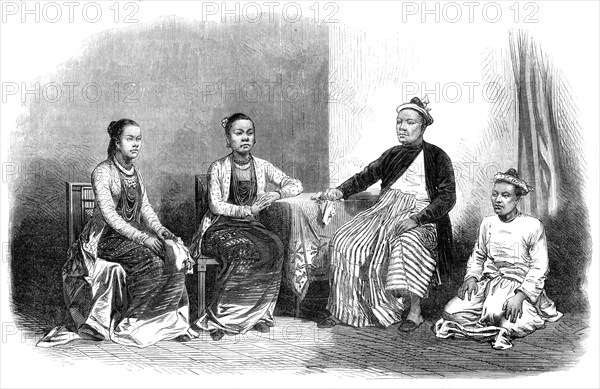 Burmese ladies and gentleman, with an attendant, 1870. Creator: Unknown.