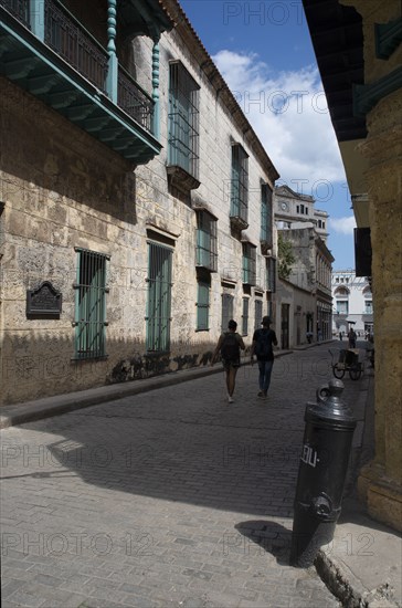 Street scene with couple in the distance, Havana, Cuba, 2024. Creator: Ethel Davies.