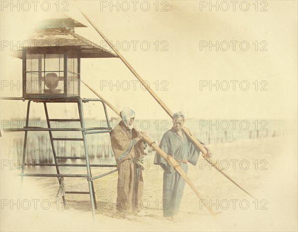 Two Men with Oars Standing Next to a Lantern, 1866-1867. Creator: Felice Beato.