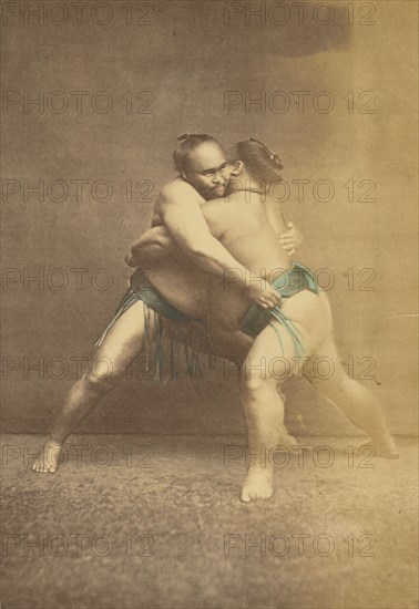 Two Japanese sumo westlers in gappling pose, 1868-1880. Creator: Felice Beato.