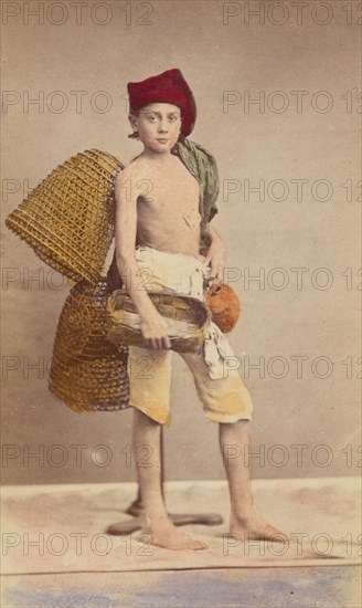 Unidentified boy wearing native costume with baskets on back and carrying a water jug..., 1870-1875. Creator: Giorgio Conrad.