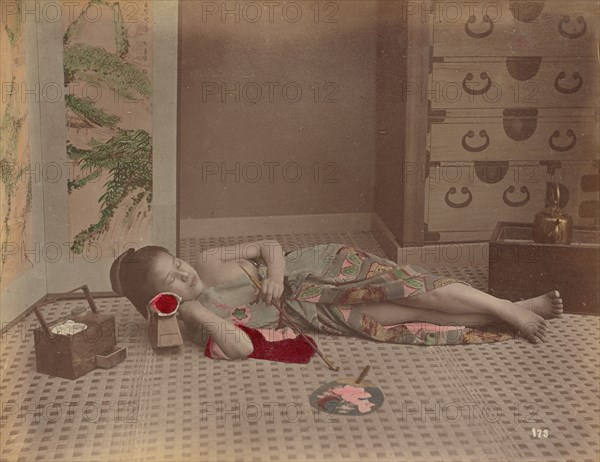 Woman Reclining with Pipe, 1870s-1890s. Creator: Kusakabe Kimbei.