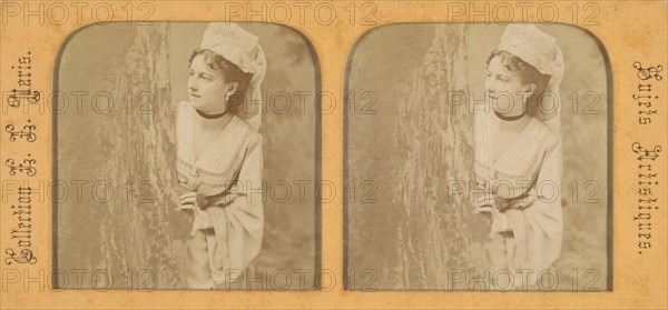 Woman in historical costume peering out around a tree, 1855-1865. Creator: Levy Fils & Cie.