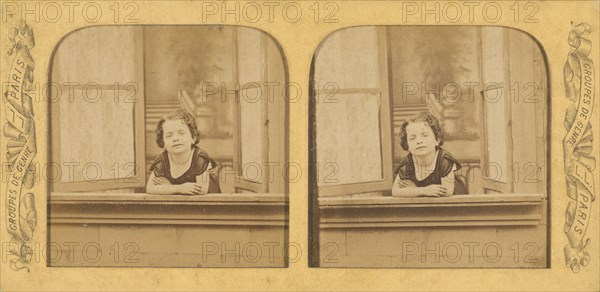 Little girl leaning out of an open window, arms crossed, 1855-1865. Creator: Levy Fils & Cie.