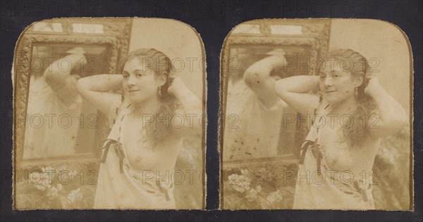 Woman before mirror with hands behind head, one breast exposed, 1855-1860. Creator: Unknown.