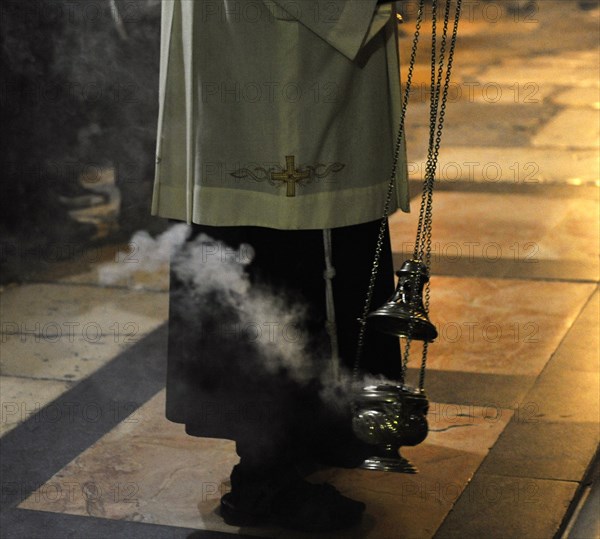 Priest uses incense, Jerusalem, Israel, 2014.  Creator: LTL.