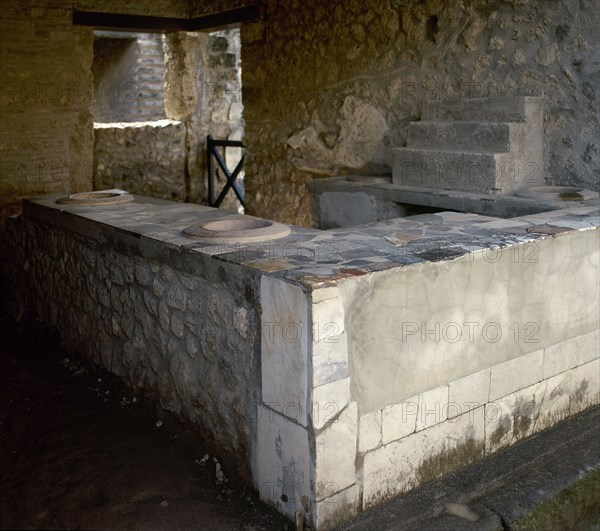 Thermopolium, commercial establishment (restaurant), Herculaneum, Italy, 2002.  Creator: LTL.