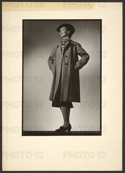 Woman modeling coat, early 1940s. Creator: Gunther Krampf.