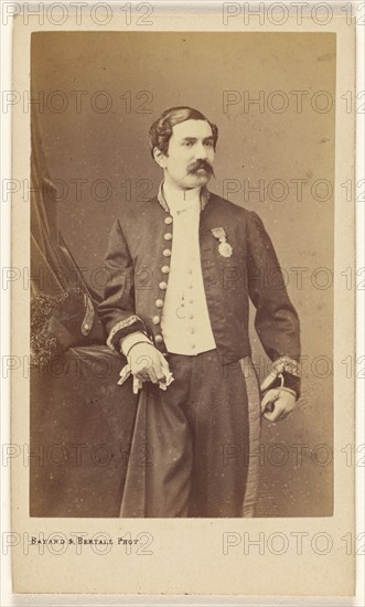 Unidentified man with moustache standing, wearing a medal on his lapel, about 1861. Creator: Bayard & Bertall.