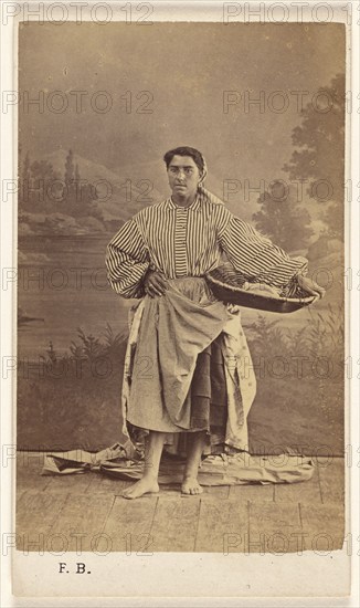 Genre portrait of an unidentified woman holding a basket, 1870-1875. Creator: Ferdinand Berillon.