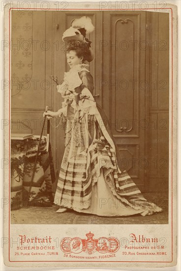 Full-length portrait of a well-dressed woman with walking stick, 1880s. Creator: Michele Schemboche.