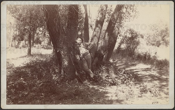 F.A. Williams resting against a tree, 1892. Creator: Unknown.