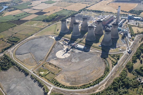 The cooling towers and disused coal stocks at Cottam Power Station, Nottinghamshire, 2022. Creator: Emma Trevarthen.