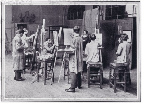 Photo from 'The Sphere' of a group of students painting the head and shoulders of a female..., c1925 Creator: Unknown.