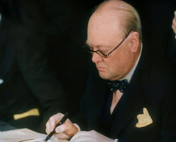 Winston Churchill Signing an Agreement Allowing the USA to use British Naval Bases in..., 1941. Creator: British Pathe Ltd.