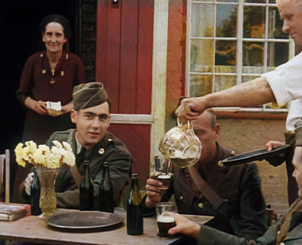 American Airmen Drinking Outside a Public House in England, and Being Served by..., 1943-1944. Creator: British Pathe Ltd.