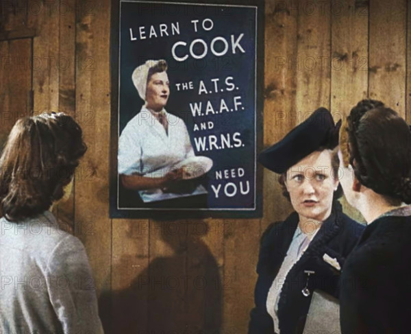 An Information Film Showing Women Looking at a Recruitment Poster for Female Army Cooks, 1942. Creator: British Pathe Ltd.