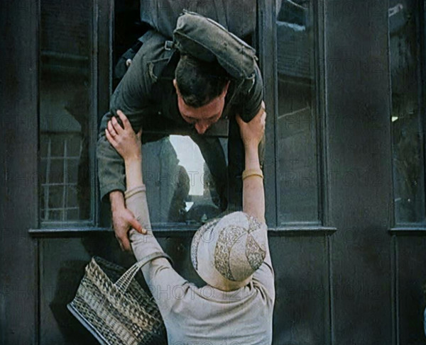 Male Soldier Kissing Female Civilian from the Window of a Train, 1929. Creator: British Pathe Ltd.