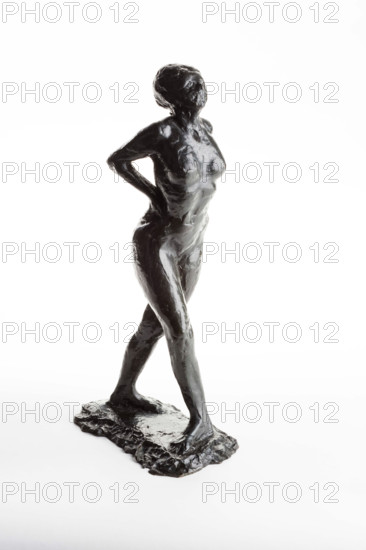 Dancer at Rest, Hands behind her Back, Right Leg Forward, cast 1920. Creator: Edgar Degas.