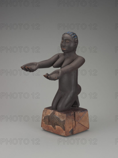 Kneeling female figure, early 20th century. Creator: Unknown.