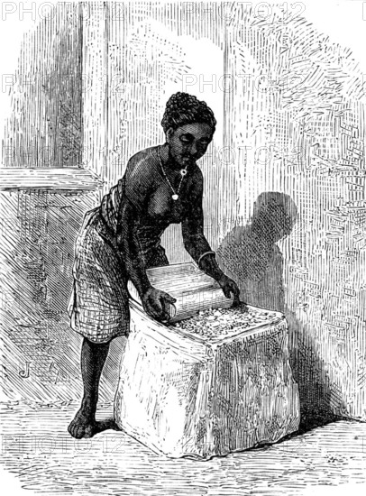 The Gold Coast and Ashantee War: woman grinding corn at Accra, 1873. Creator: Unknown.