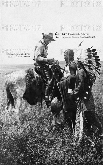 Photo postcard, posted on November, 30 1909, representing a Cow-boy using signs to communicate with Indians