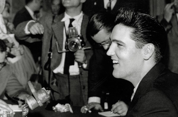 Elvis Presley at a press conference in Paris, France (circa 1958) 
File Reference # 33848-389THA