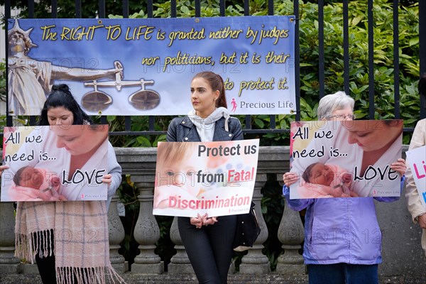 Pro life protesters outsider the Belfast High court with signs, as Northern Ireland abortion laws are being challenged