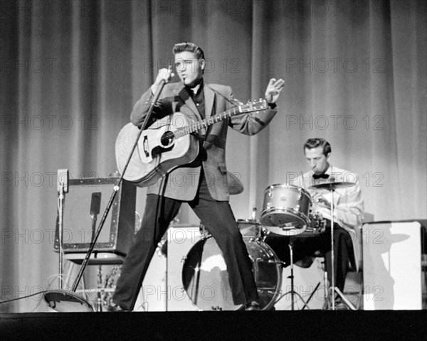 Elvis Presley, performing on stage, May 26, 1956.