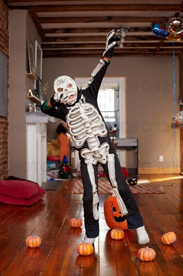 Black boy wearing skeleton Halloween costume