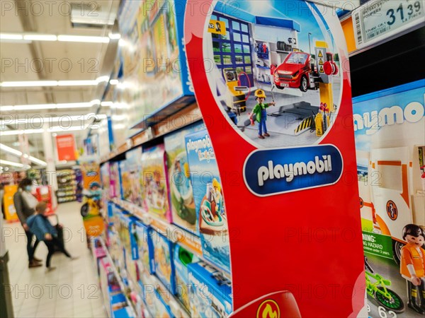 Puilboreau, France - October 14, 2020: Selected Focus on advertising board Playmobil displayed in a supermarket shelf