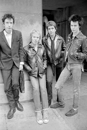 Sex Pistols punk rock band seen here in a London  Circa 1st May 1977
Left is Johnny Rotten - singer 
2nd left is Paul Cook - drums
3rd from left is Steve Jones - electric guitar 
Far right is Sid Vicious - bass guitar

Picture taken 1st May 1977

vfr1