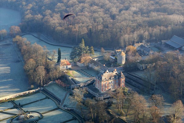 Rosay, France - January 3, 2010: Aerial view paramotor flying over Haut Rosay castle in Yvelines (78790), Ile-de-France region, France