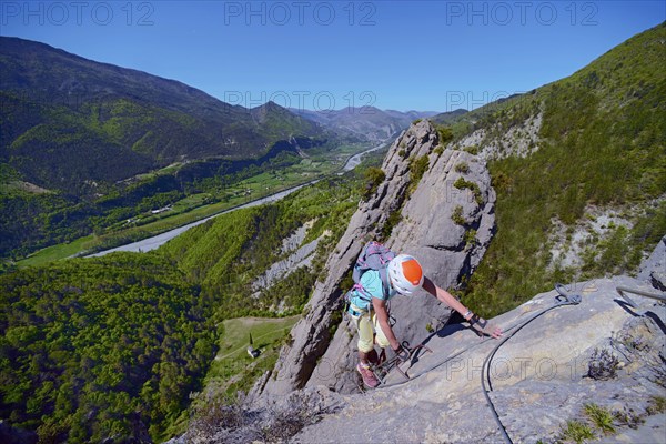 climber on via ferrata Demoiselles du Castagnet, France, Alpes Maritimes, Puget Theniers