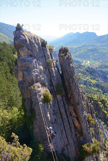 climber on via ferrata Demoiselles du Castagnet, France, Alpes Maritimes, Puget Theniers