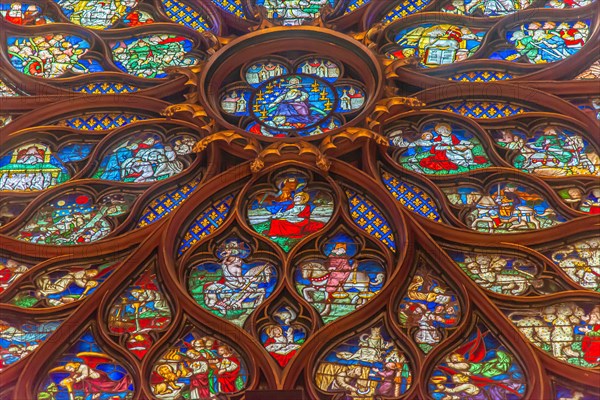 Paris, France - Dec. 27 2022: The stunning stained glass window and the beautiful ceiling in Saint-Chapelle in Paris