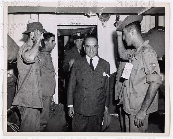 Brazilian President Inspects Coast Guard-Manned Transport. President Getulio Vargas enters the troop quarters on an inspection tour through a Coast Guard-manned troop transport which carried Brazilian forces to the European War Theatre. Brazilian soldiers give him a snappy salute. Behind President Vargas is Coast Guard Captain George W. McKean, Skipper of the transport, whom the Brazilian government decorated with the Medal of Military Merit for the safe transport of the Republic's troops overseas.