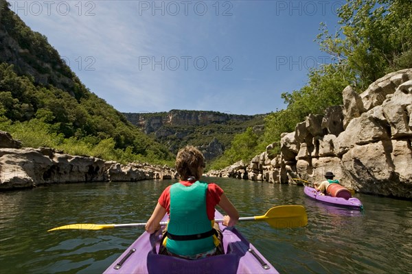 Going down the gorges of the Ardeche river in a canoe (France).  Descente des Gorges de l'Ardèche en canoë (France).