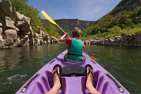 Going down the gorges of the Ardeche river in a canoe (France).  Descente des Gorges de l'Ardèche en canoë (France).