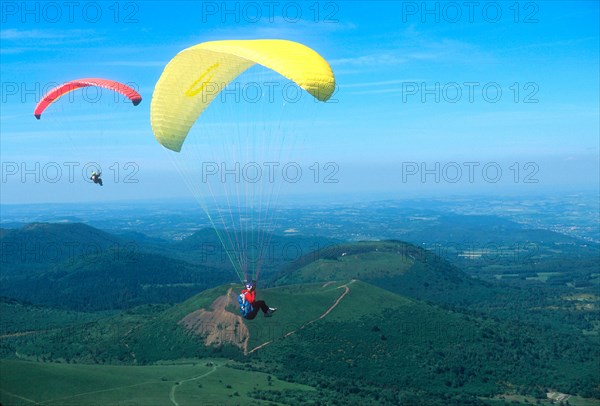 Hang gliding near the Puy de Dome volcano in Auvergne, France.