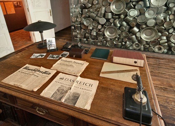 Schindler's desk in his office, artistic installation by Michal Urban behind, Oskar Schindler's Factory Museum in Krakow, Poland