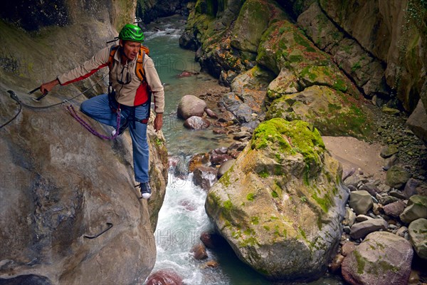 man climbing at via ferrata, France, Mercantour National Park, Lantosque