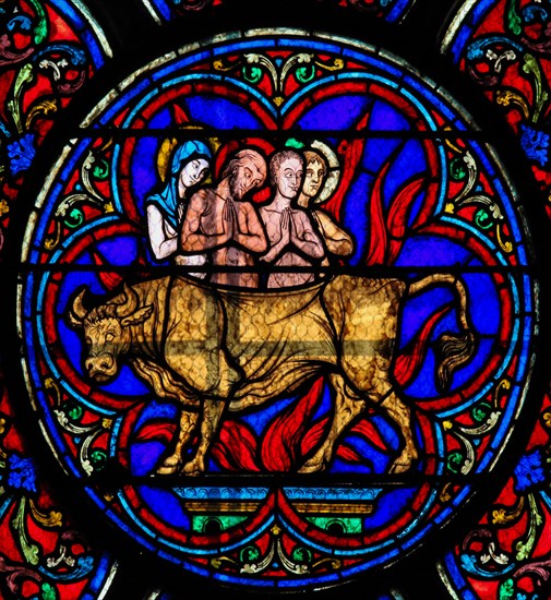 Stained Glass in Notre Dame Cathedral of Paris depicting the Adoration of the Golden Calf, as mentioned in the Old Testament, Exodus.